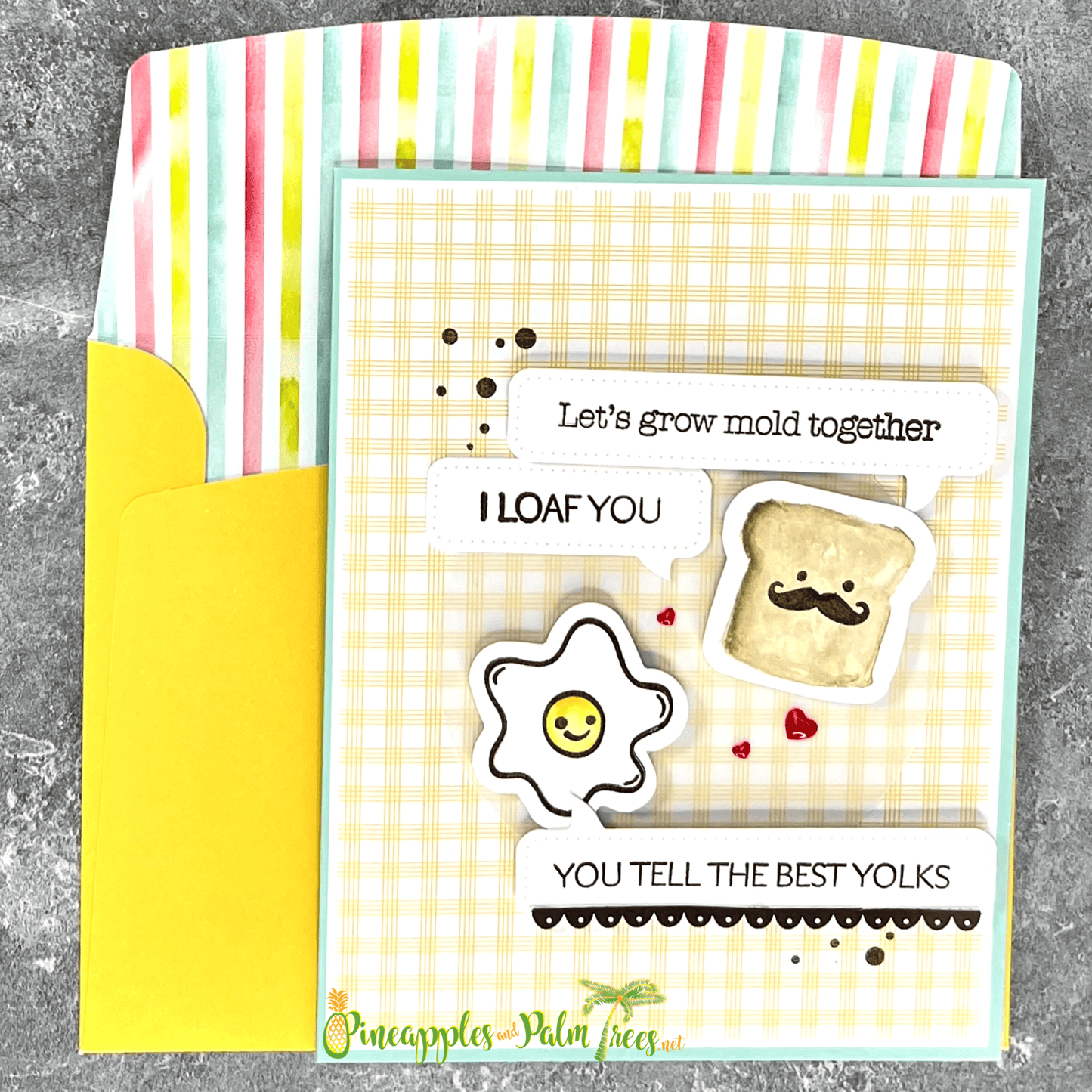 Whimsical greeting card with the phrase ‘Let’s Grow Mold Together — I Loaf You - You Tell the Best Yolks’ illustrated with eggs and toast, shown with its matching envelope — playful and handmade.
