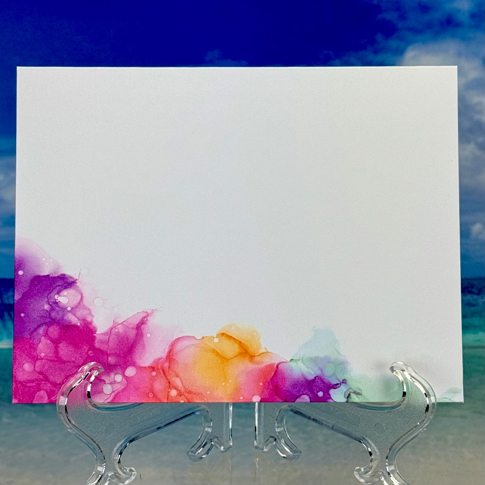 Interior of a colorful floral bouquet illustration greeting card with “Thinking of You” showing blank writing space.