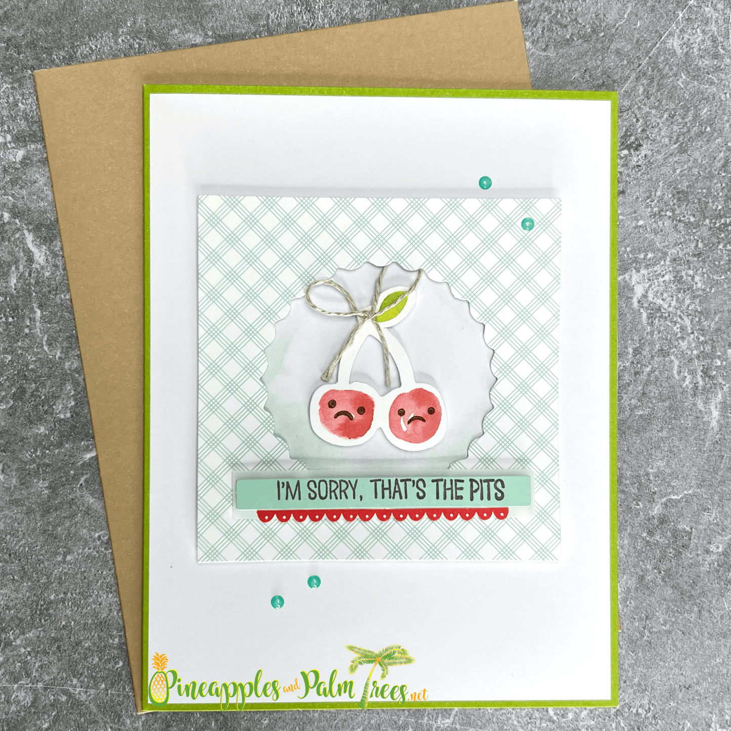 Greeting card with the message ‘I’m Sorry — That’s the Pits’ and cherry illustrations, shown with its matching envelope — a sweet, lighthearted apology card.

