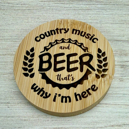 Round laser-engraved bottle opener with “Country Music & Beer, That’s Why I’m Here” design.