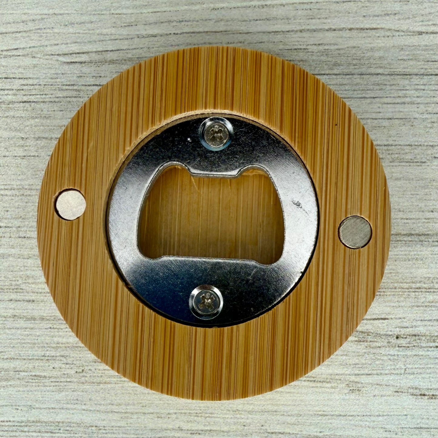 Back of the Professional Beer Tester round lasered bottle opener.