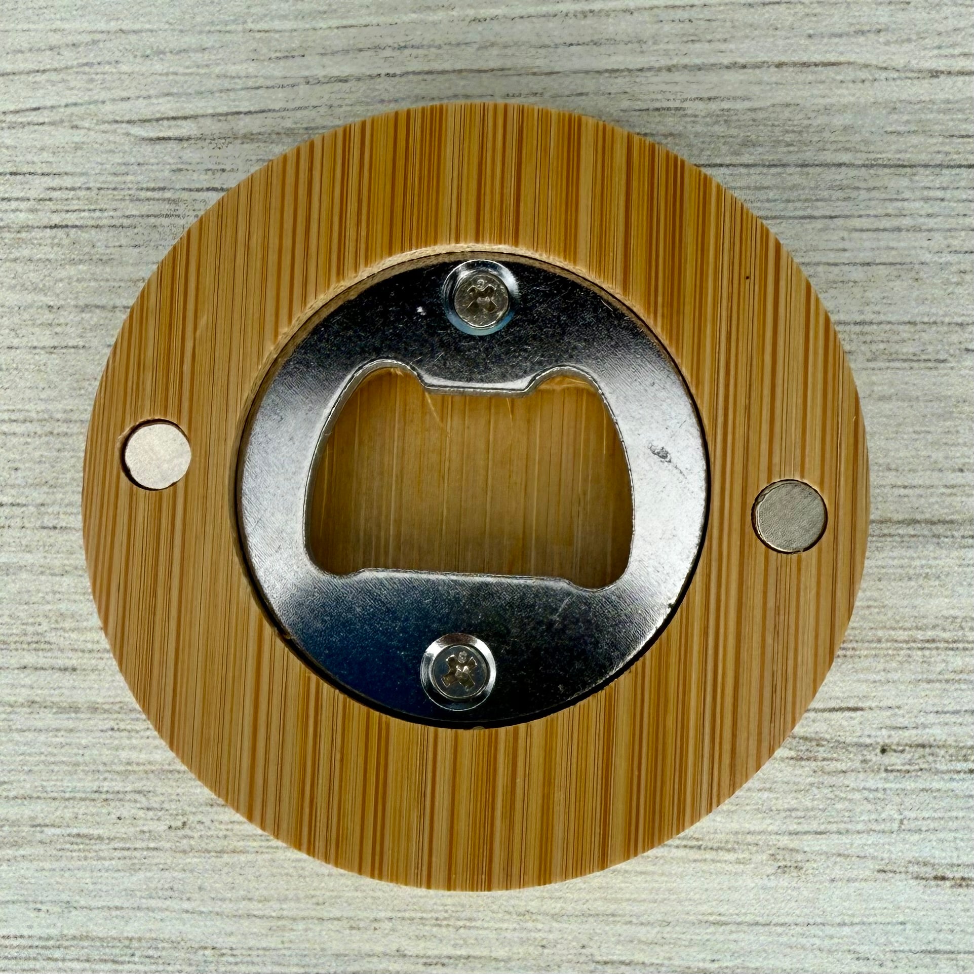Back of the Professional Beer Tester round lasered bottle opener.