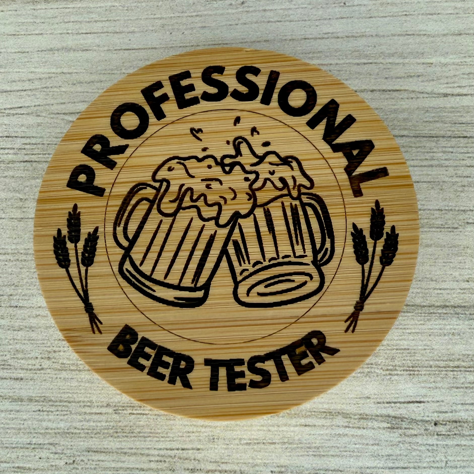 Round laser‑engraved bottle opener with “Professional Beer Tester” design, ideal for beer lovers and home bars.