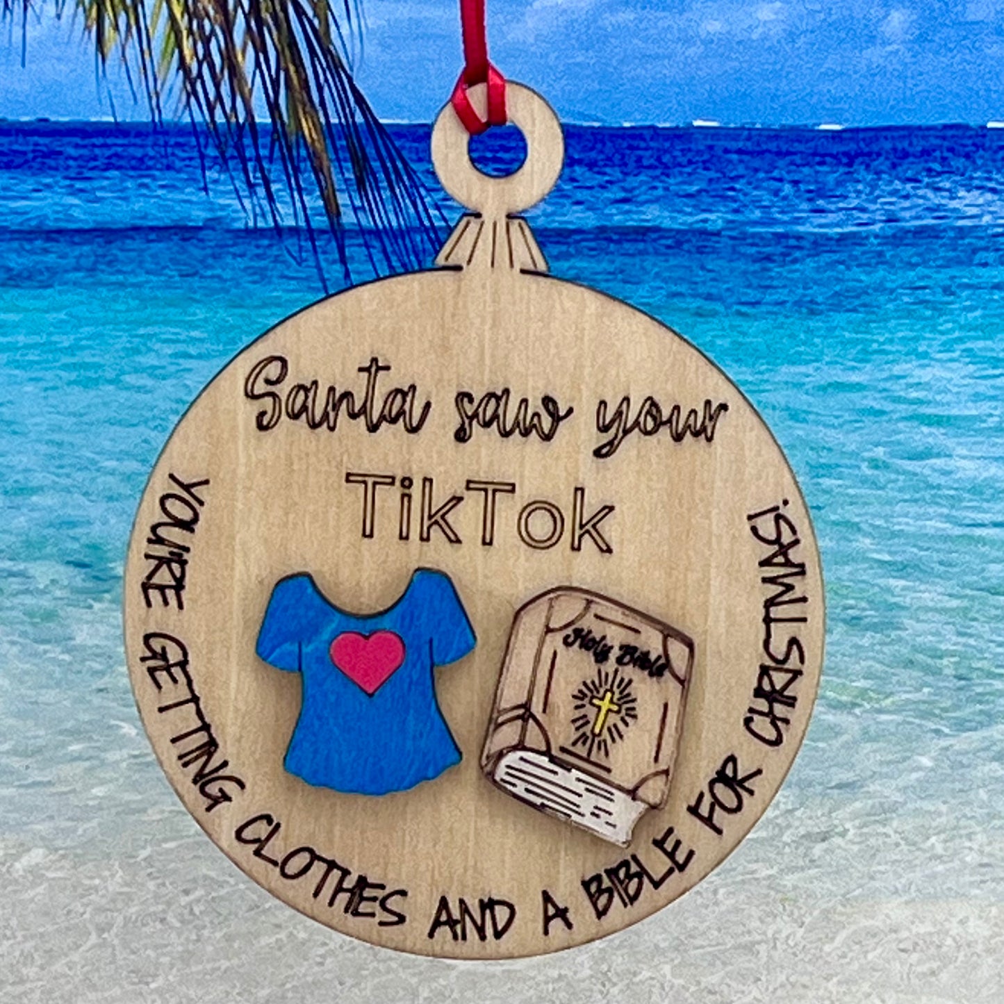 Lasered Christmas ornament with humorous “Santa Saw Your TikTok” design, perfect for holiday décor and gifting.