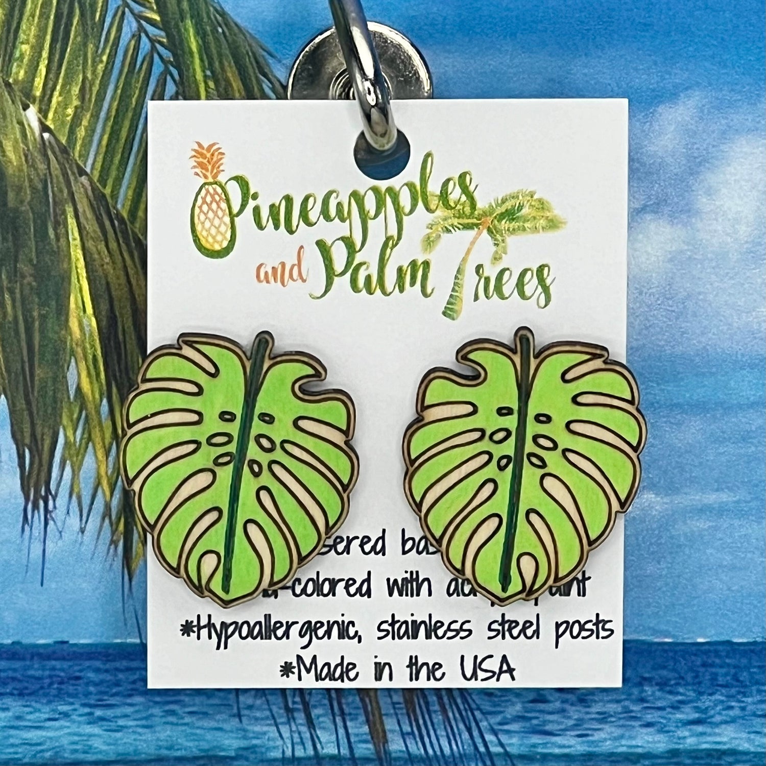 Lasered monstera leaf stud earrings with tropical design, perfect for gifting or everyday wear.