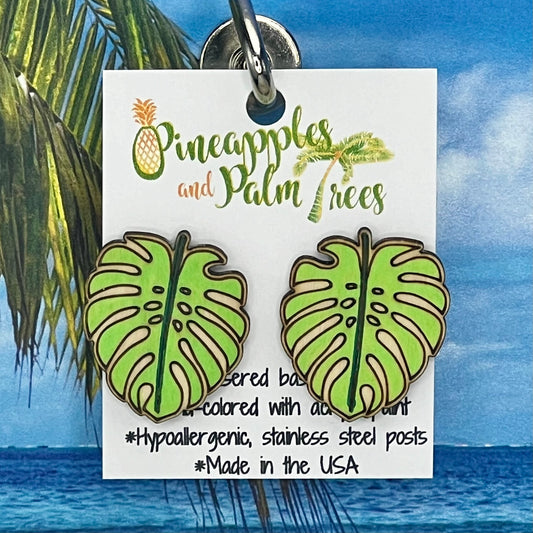 Lasered monstera leaf stud earrings with tropical design, perfect for gifting or everyday wear.
