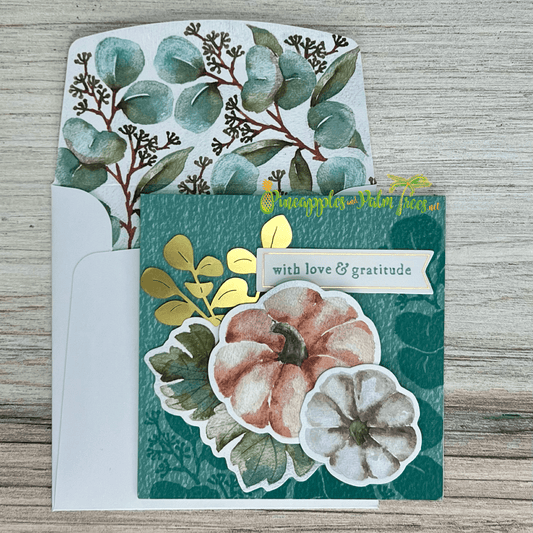 Autumn-style greeting card with pumpkins and the message “With Love and Gratitude” on the front.