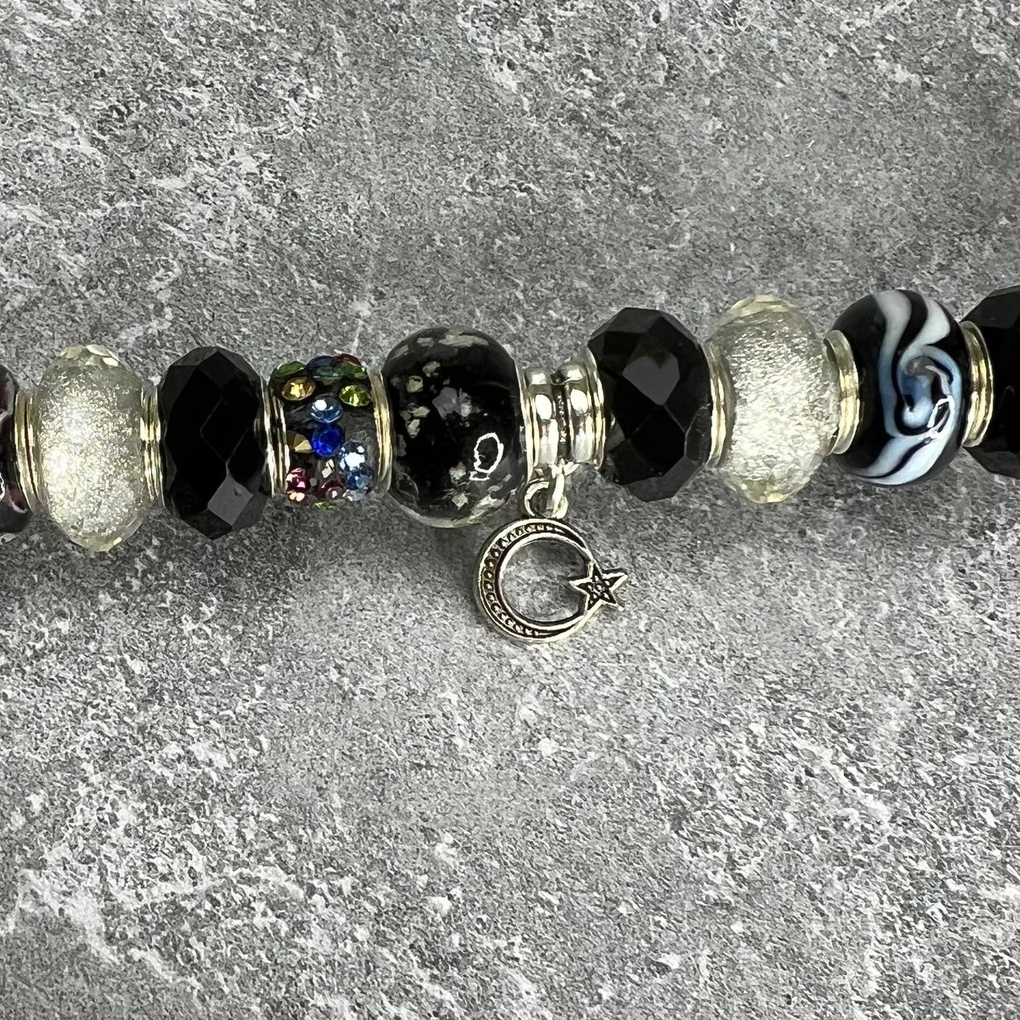 Black and white metal garden stake with moonlit starry night design — celestial outdoor décor.
