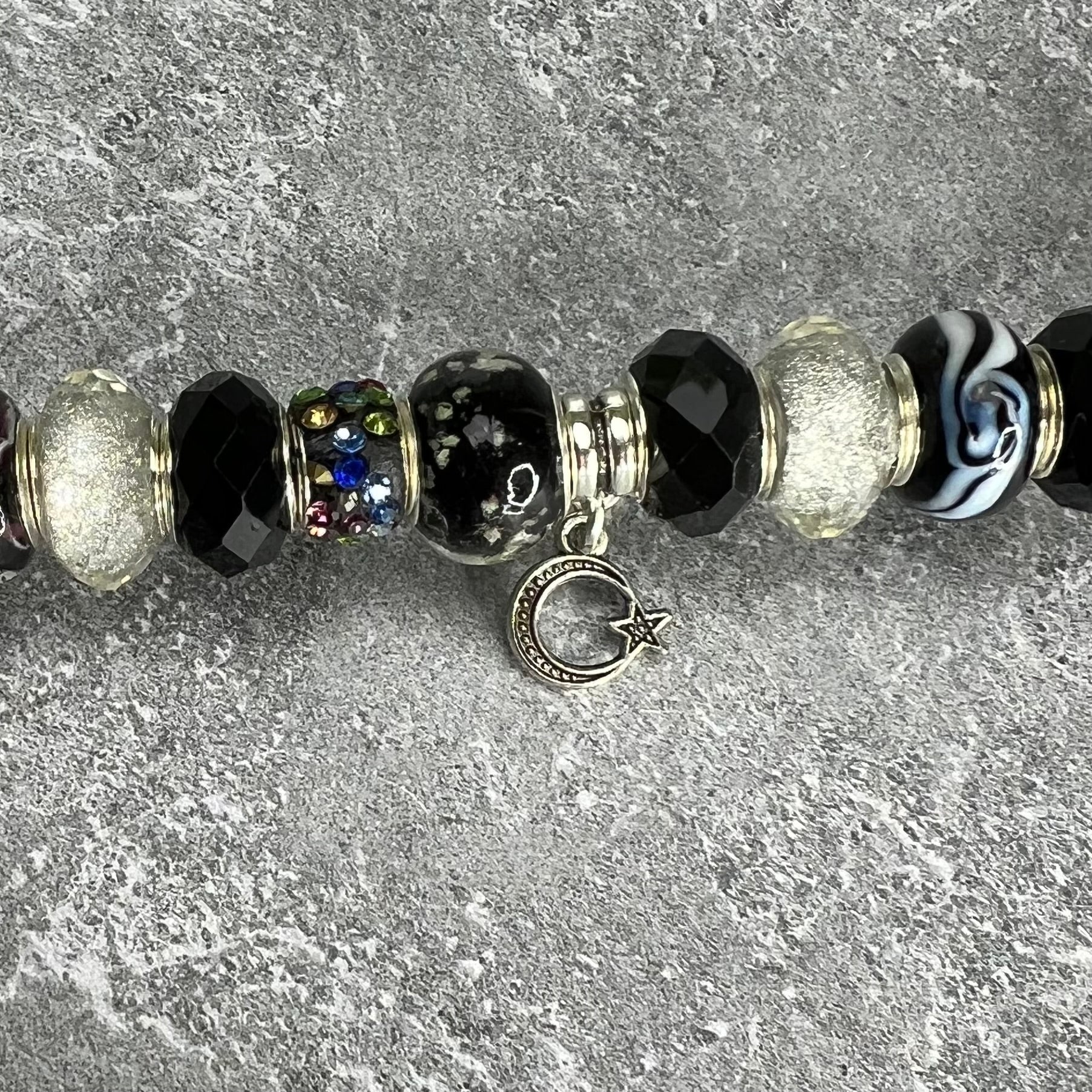 Black and white metal garden stake with moonlit starry night design — celestial outdoor décor.
