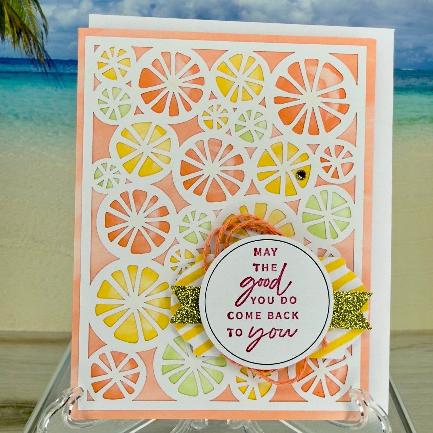 Greeting card “May the good you do come back to you” with citrus motif on front.