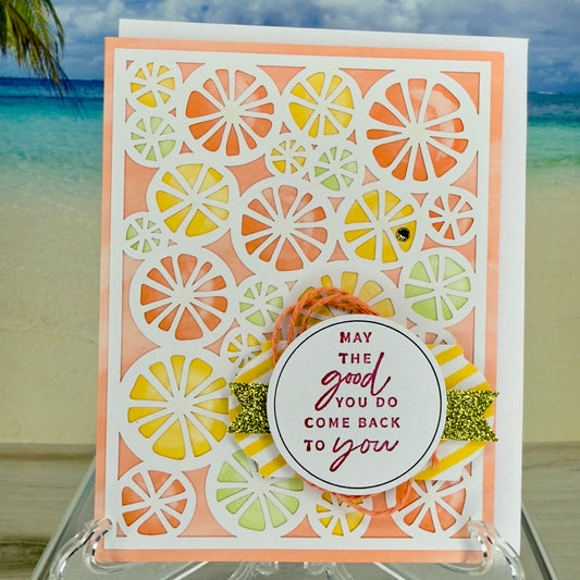 Greeting card “May the good you do come back to you” with citrus motif on front.