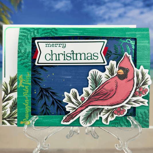 Handcrafted “Merry Christmas” greeting card in red and cardinal design — front view.