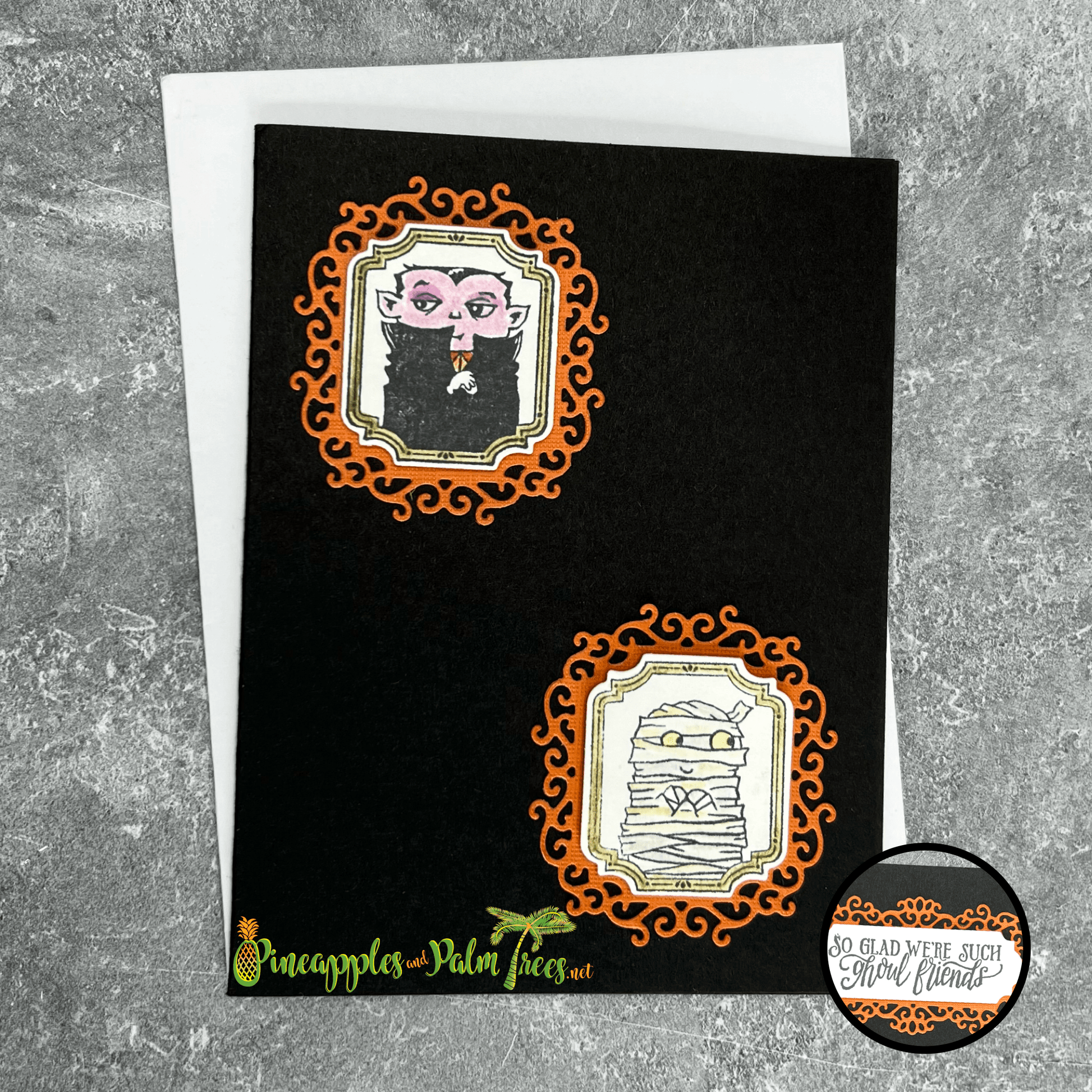 Handcrafted “Mummy & Dracula” framed greeting card with orange and black Halloween design on front.
