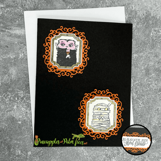 Handcrafted “Mummy & Dracula” framed greeting card with orange and black Halloween design on front.