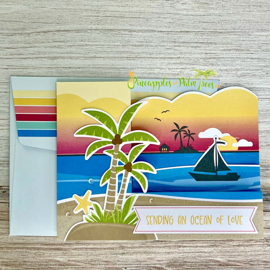 Greeting card “Sending an Ocean of Love” with a serene beach scene illustration on the front.
