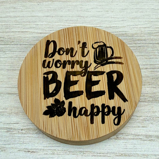 Round laser‑engraved bottle opener with playful “Don’t Worry, Beer Happy” lettering.