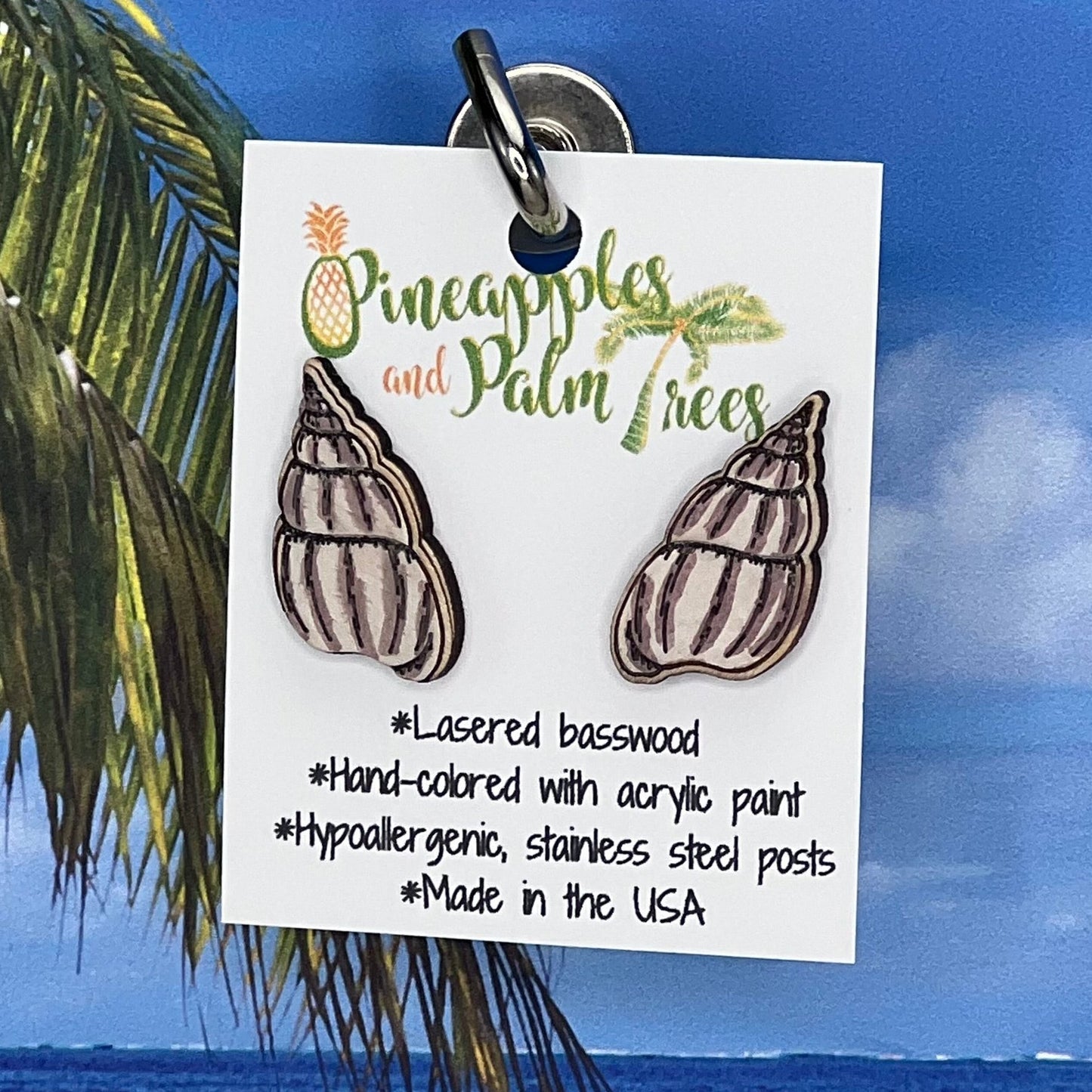 Lasered wolf snail shell stud earrings with ocean-inspired design, perfect for gifting or everyday wear.