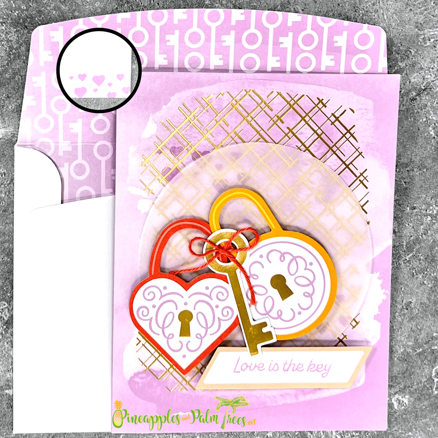 Greeting card “Love Is The Key” showing a purple lock-and-key illustration on front cover.