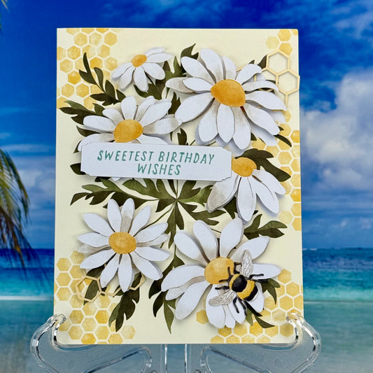 Birthday greeting card ‘Sweetest Birthday Wishes’ with a cheerful daisy bouquet illustration.