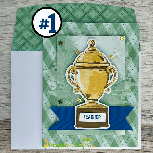 Handmade teacher appreciation greeting card with trophy design and the word “Teacher” on the front.
