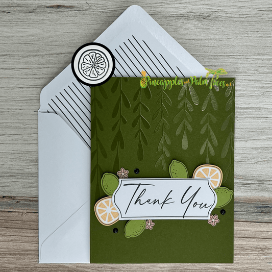 Greeting card “Thank You” featuring bright citrus fruit illustration on front cover.