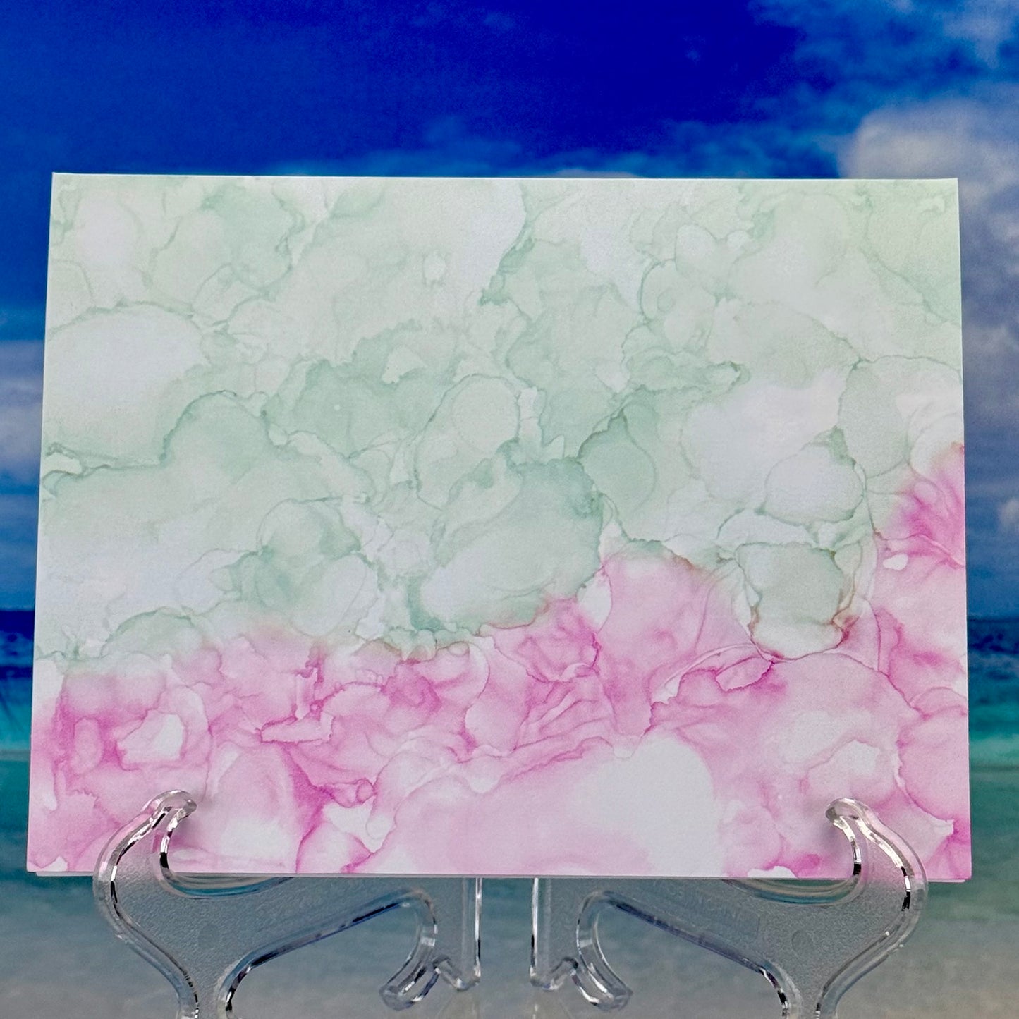 Back details of the greeting card with “Thinking of You” and colorful floral bouquet illustration on front cover.