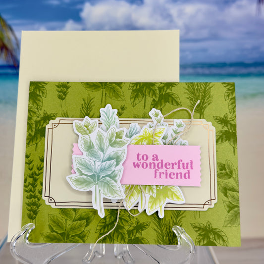 Greeting card “To a Wonderful Friend” with green leaves illustration on the front cover.