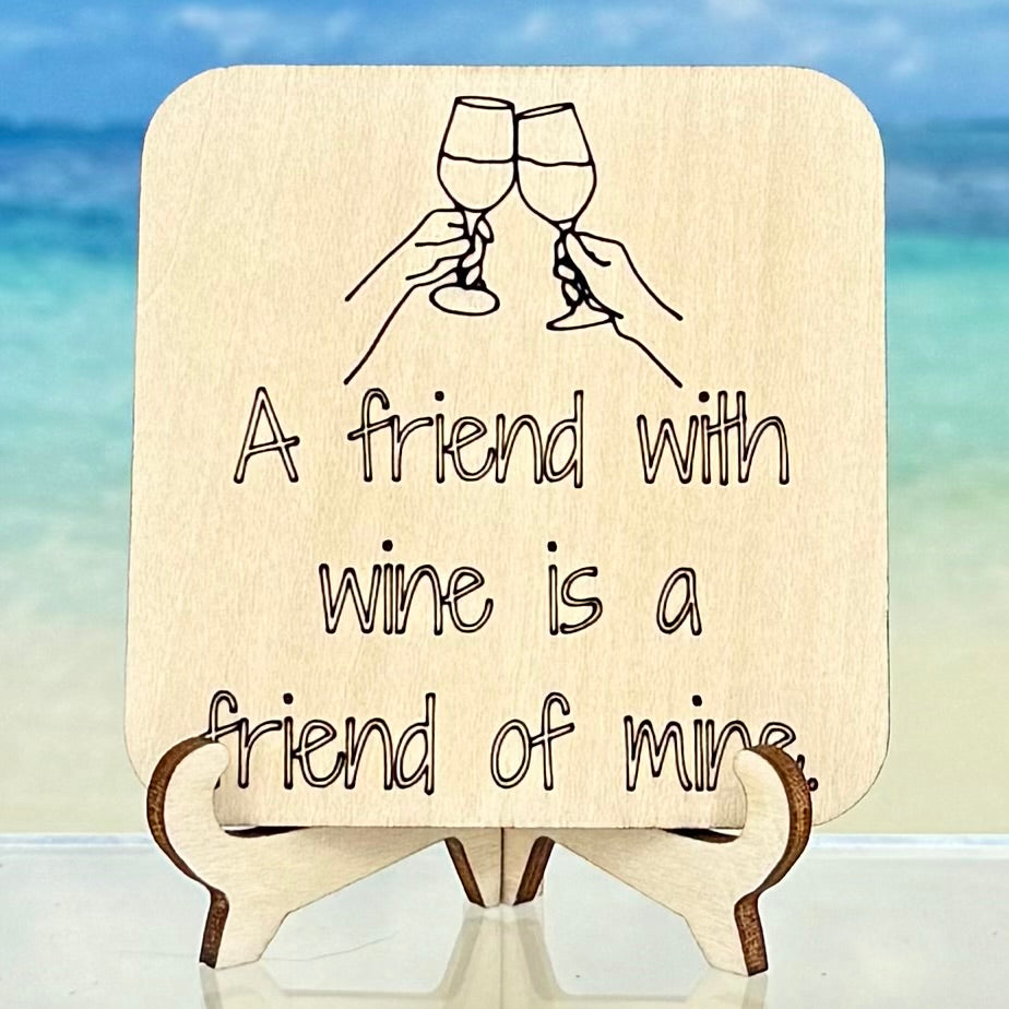 Laser-cut wooden fridge magnet engraved with the quote ‘A Friend with Wine is a Friend of Mine’ — handcrafted kitchen decor gift for wine lovers.