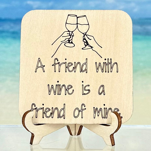 Laser-cut wooden fridge magnet engraved with the quote ‘A Friend with Wine is a Friend of Mine’ — handcrafted kitchen decor gift for wine lovers.