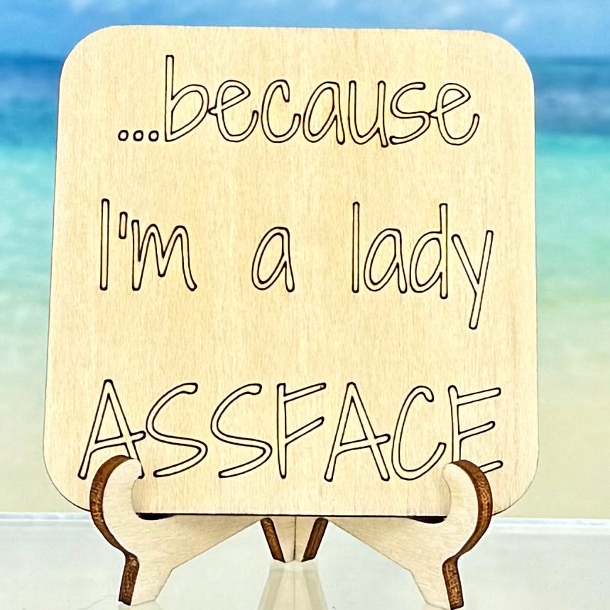 Laser-cut wooden fridge magnet engraved with the cheeky quote ‘Because I’m a Lady Assface’ — handcrafted and designed to add humor to your kitchen or gift to a bold friend.