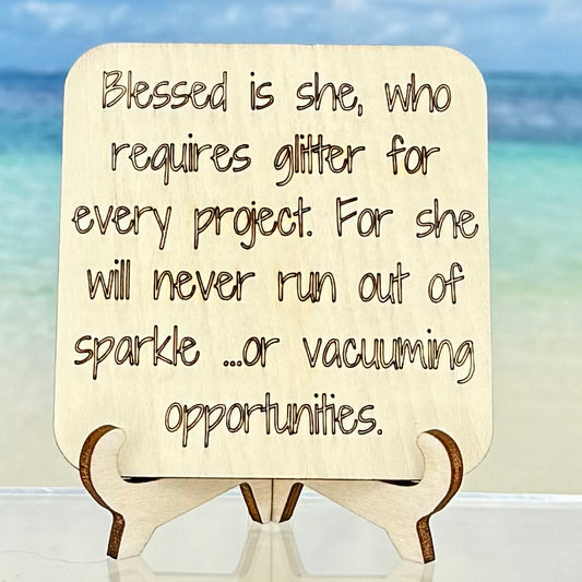 Laser-cut wooden fridge magnet engraved with the quote ‘Blessed is she, who requires glitter for every project, for she shall never run out of sparkle…or vacuuming opportunities.’ — handcrafted with strong magnet backing, perfect gift for crafty souls.