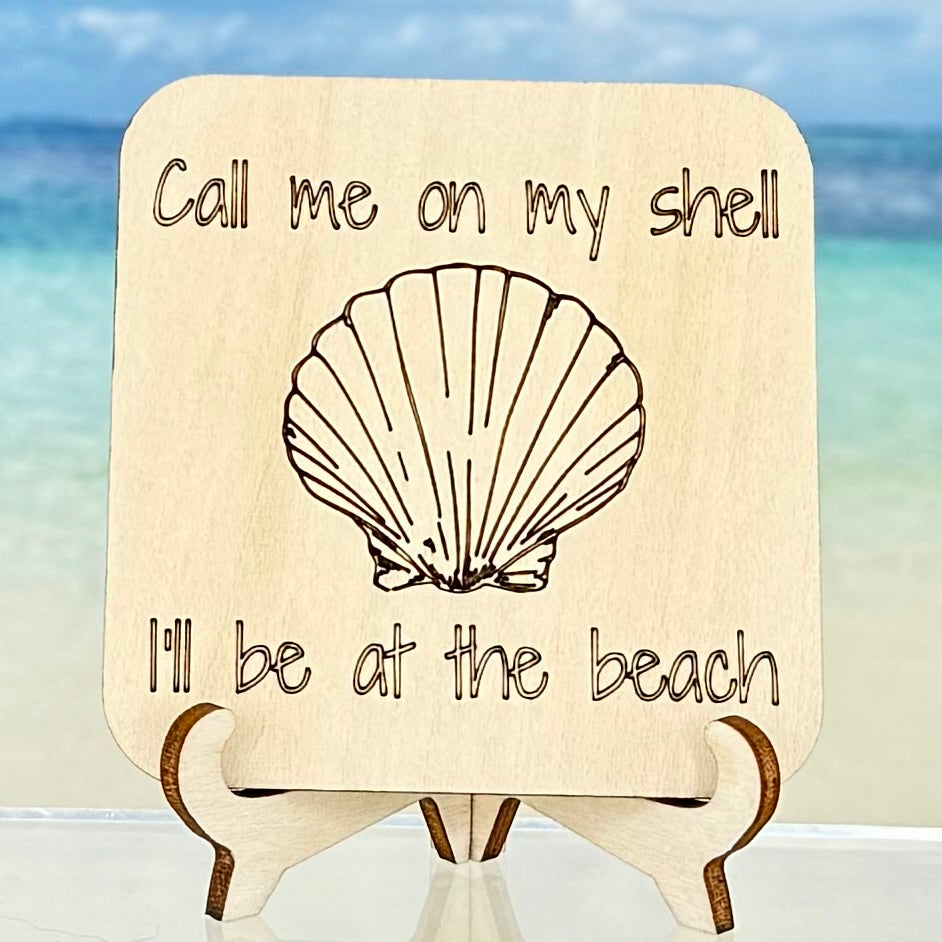 Laser-cut wooden fridge magnet engraved with the quote ‘Call me on my shell, I’ll be at the beach’ — handcrafted beach-themed décor with strong magnet backing, perfect for coastal homes or gifts for ocean lovers.
