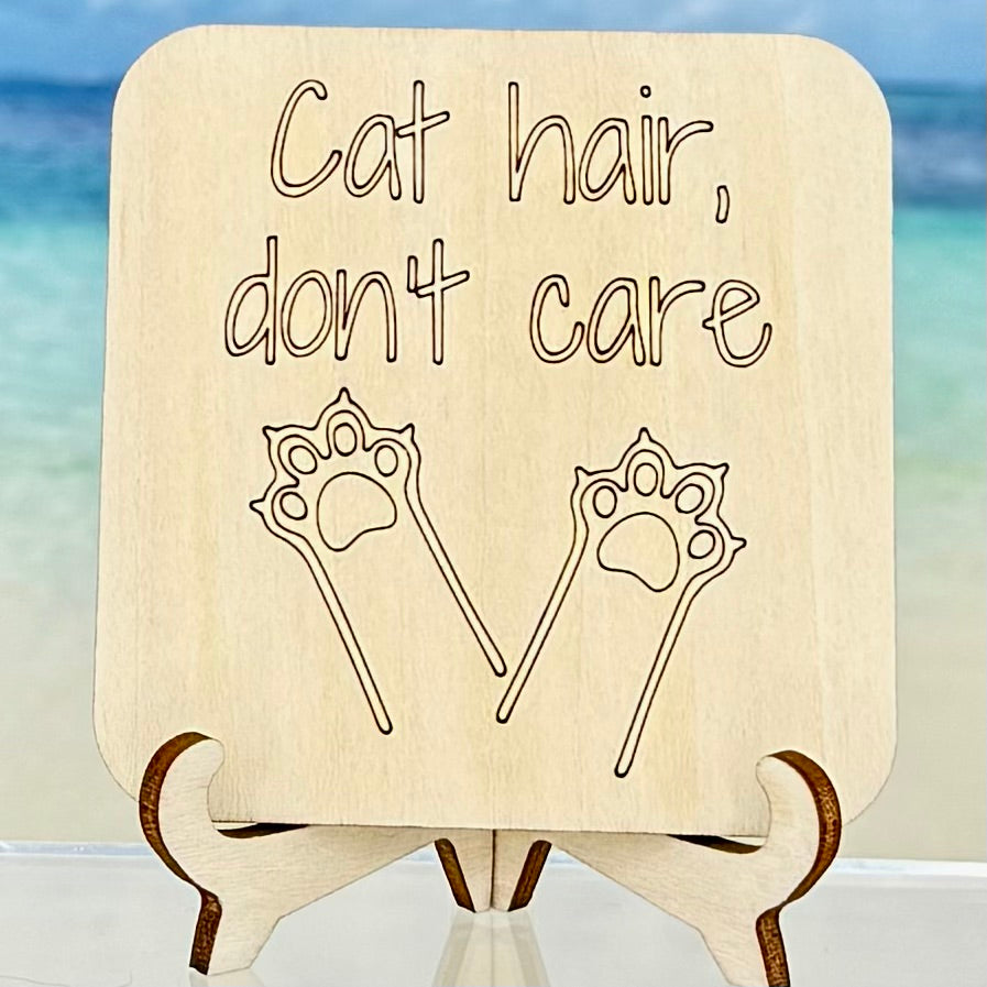 Laser-cut wooden fridge magnet engraved with the quote ‘Cat Hair, Don’t Care!’ — handcrafted and humorous décor for passionate cat owners.