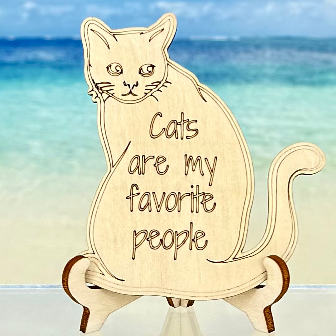 Laser-cut wooden fridge magnet engraved with the quote ‘Cats are my favorite people’ — handcrafted, approx. 2.5″ square, with strong magnet backing; a perfect gift for cat lovers.