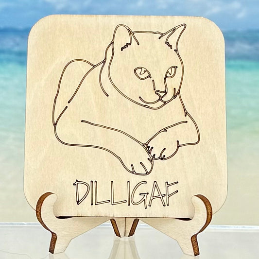 Laser-cut wooden fridge magnet engraved with ‘DILLIGAF (Do I Look Like I Give A F…?)’, featuring a cat design — handcrafted décor piece with strong magnet backing for cat lovers and sarcasm fans.