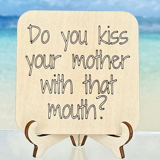 Laser-cut wooden fridge magnet engraved with the quote ‘Do You Kiss Your Mother with That Mouth?’ — handcrafted and humorous décor piece with strong magnet backing.