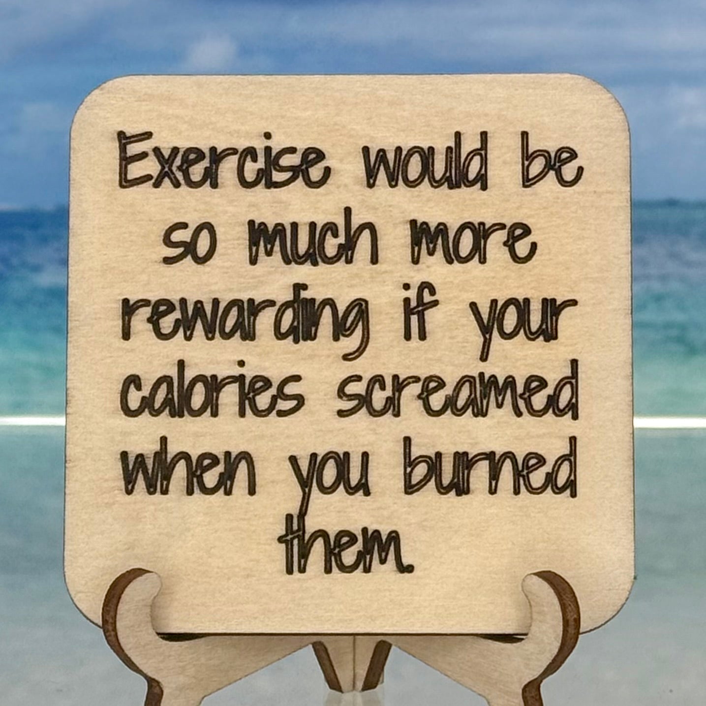 Laser-cut wooden fridge magnet engraved with the quote ‘Exercising would be so much more rewarding if your calories screamed when you burned them.’ — handcrafted humorous décor piece with strong magnet backing, perfect for gym lovers and snack fans.