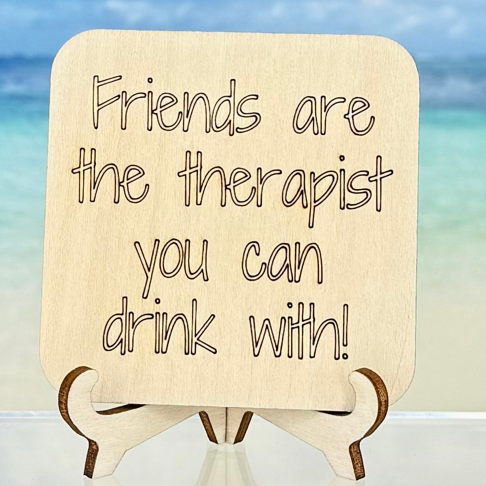 Laser-cut wooden fridge magnet engraved with the quote ‘Friends are the therapist you can drink with!’ — handcrafted décor piece with strong magnet backing, ideal for celebrating friendship and humor.