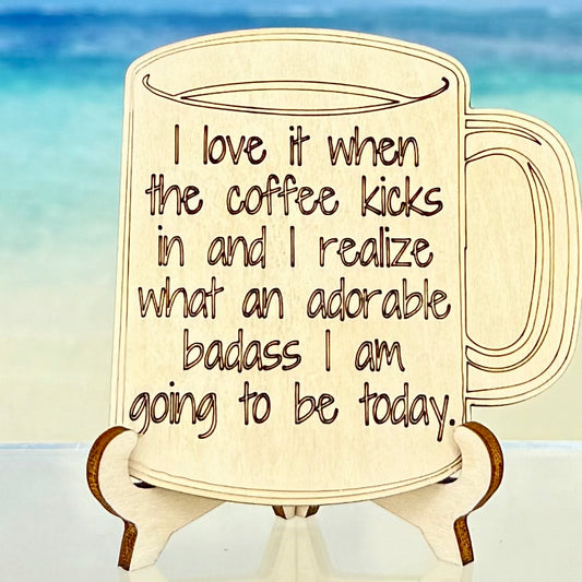 Laser-cut wooden fridge magnet engraved with the quote ‘I love it when the coffee kicks in and I realize what an adorable badass I am going to be today’ — handcrafted and humor-filled décor for coffee lovers.