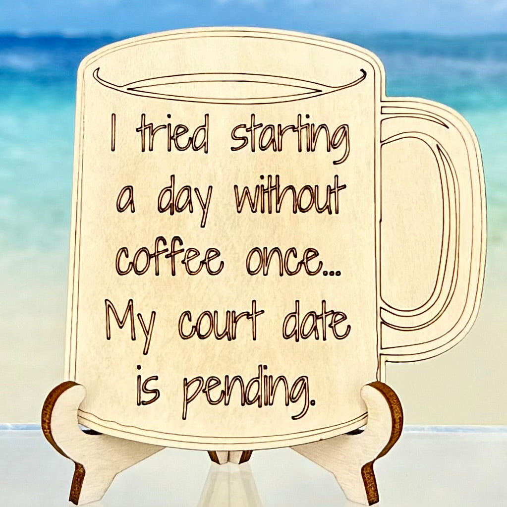 Laser-cut wooden fridge magnet engraved with the quote ‘I Tried Starting a Day Without Coffee Once… My Court Date Is Pending’ — handcrafted humorous décor with strong magnet backing.