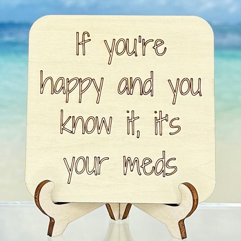 Laser-cut wooden fridge magnet engraved with the quote ‘If you’re happy and you know it, it’s your meds’ — handcrafted humor décor for the kitchen, office or gift-giving.