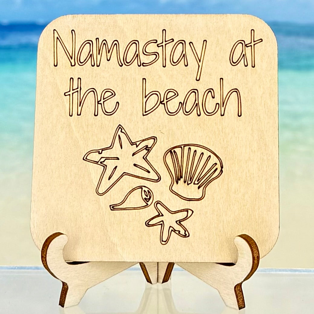 Laser-cut wooden fridge magnet engraved with the quote ‘Namastay at the beach’ and sea shell icons — handcrafted coastal décor perfect for beach lovers and seaside homes.
