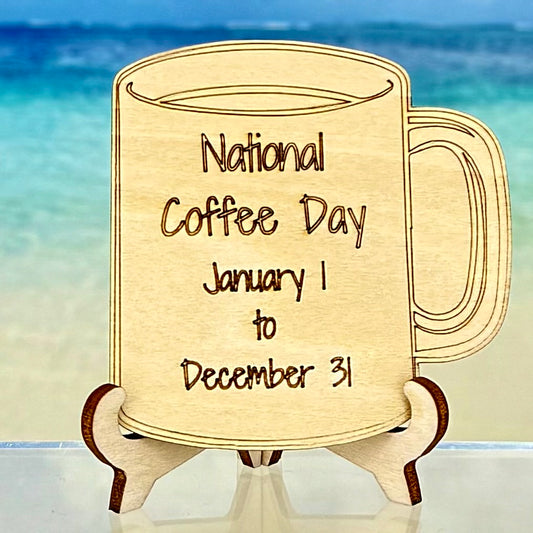 Laser-cut wooden fridge magnet engraved with the quote ‘National Coffee Day January 1 to December 31’ and a coffee cup icon — handcrafted décor for avid coffee lovers who know every day is a celebration.