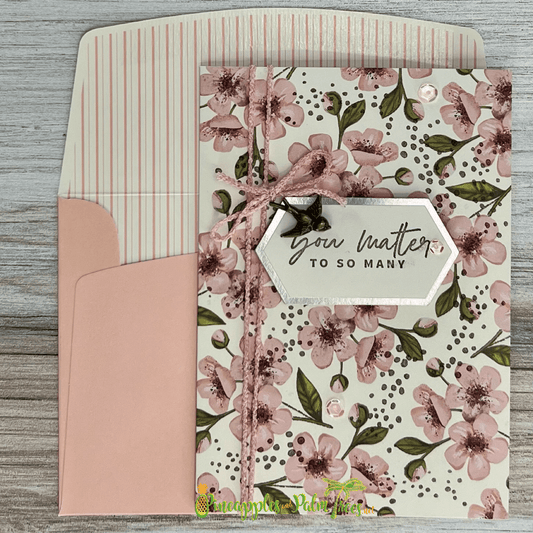 Heartfelt greeting card with colorful floral illustration and the message “You Matter to So Many” on the front.