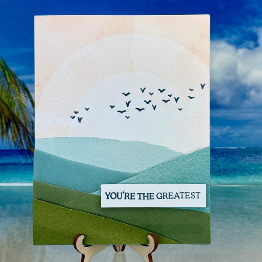 Encouraging greeting card “You’re the Greatest” with mountain illustration on the front cover.